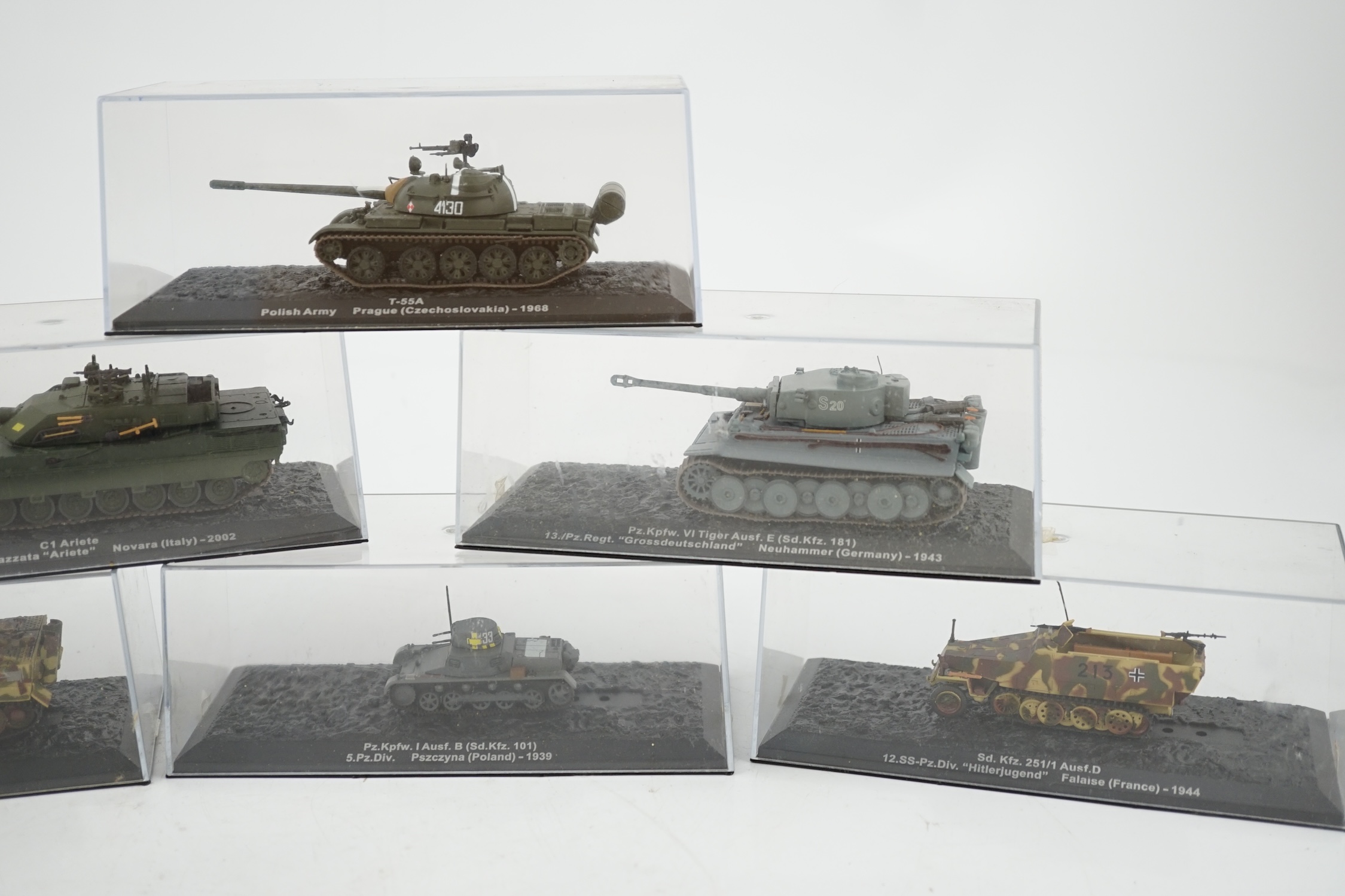 Sixty-eight magazine issue military vehicles in plastic display cases, including; tanks, armoured cars, personnel transporters, etc.